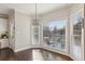 Bright breakfast nook with hardwood floors, large windows, and a chandelier, perfect for enjoying meals at 5975 Deerwoods Trl, Alpharetta, GA 30005