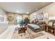 Comfortable living room featuring large couch, natural light, and decorative wall art at 595 Everton Pl, Grayson, GA 30017