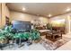 Spacious living room with large TV, comfortable seating, and natural light at 595 Everton Pl, Grayson, GA 30017