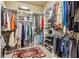 Walk-in closet offers ample storage space with custom shelving and organization at 595 Everton Pl, Grayson, GA 30017