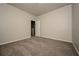 Simple bedroom with neutral walls and carpet at 604 Beaujolais Ct, Mcdonough, GA 30253