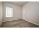 Well-lit bedroom with neutral walls and carpet at 604 Beaujolais Ct, Mcdonough, GA 30253