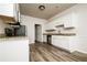 Modern kitchen with white cabinets, granite countertops, and stainless steel appliances at 604 Beaujolais Ct, Mcdonough, GA 30253