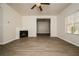 Bright living room featuring a corner fireplace and neutral decor at 604 Beaujolais Ct, Mcdonough, GA 30253