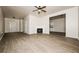 Spacious living room with fireplace and wood-look floors at 604 Beaujolais Ct, Mcdonough, GA 30253