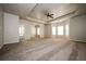 Large main bedroom with carpeted floors and a ceiling fan at 604 Beaujolais Ct, Mcdonough, GA 30253