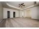 Spacious main bedroom with carpet, ceiling fan, and ample closet space at 604 Beaujolais Ct, Mcdonough, GA 30253