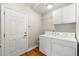 Convenient laundry room with washer, dryer, and extra storage at 108 Magnolia Grv, Alpharetta, GA 30022