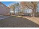 Expansive backyard with mature trees and a lush lawn at 324 Mary Dr, Mcdonough, GA 30252