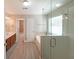 Modern bathroom with a glass-enclosed shower, soaking tub, and dual sink vanity at 324 Mary Dr, Mcdonough, GA 30252