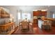 Dining area adjoining kitchen, showcasing hardwood floors and modern lighting at 324 Mary Dr, Mcdonough, GA 30252