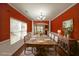 Elegant dining room with hardwood floors and a rustic wood table setting at 324 Mary Dr, Mcdonough, GA 30252