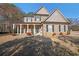 Charming two-story home with a well-manicured lawn and inviting front porch at 324 Mary Dr, Mcdonough, GA 30252