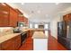 Gourmet kitchen with stainless appliances, granite counters, and an open floor plan at 324 Mary Dr, Mcdonough, GA 30252