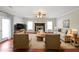 Bright and airy living room features a fireplace, neutral decor, and an open layout at 324 Mary Dr, Mcdonough, GA 30252