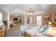 Spacious primary bedroom with a tray ceiling and an adjoining sitting area at 324 Mary Dr, Mcdonough, GA 30252