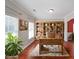 Home office with built-in bookshelves, natural light, and hardwood floors at 324 Mary Dr, Mcdonough, GA 30252