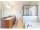 Main bathroom with double vanity, granite countertop, and shower at 129 Janney Cir, Mcdonough, GA 30253