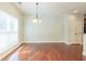Bright dining room with hardwood floors and a chandelier at 129 Janney Cir, Mcdonough, GA 30253