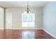 Bright dining room with hardwood floors and a large window at 129 Janney Cir, Mcdonough, GA 30253