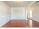 Formal dining room with hardwood floors and wainscoting at 129 Janney Cir, Mcdonough, GA 30253