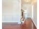 Elegant entryway with hardwood floors, wainscoting, and staircase at 129 Janney Cir, Mcdonough, GA 30253