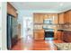 Kitchen with wood cabinets, granite counters, and stainless steel appliances at 129 Janney Cir, Mcdonough, GA 30253