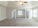 Large main bedroom with ceiling fan and neutral carpeting at 129 Janney Cir, Mcdonough, GA 30253