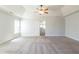 Spacious main bedroom with ceiling fan and carpeting at 129 Janney Cir, Mcdonough, GA 30253