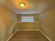 Small basement room with window and hardwood floors at 2326 Union Grove Ct, Lithonia, GA 30058