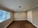 Spacious bedroom with large window and hardwood floors at 2326 Union Grove Ct, Lithonia, GA 30058