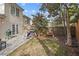 Spacious backyard with a patio, grill, and mature trees, creating a private and inviting setting at 1827 Rockridge Pl, Atlanta, GA 30324