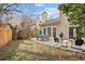 Lush backyard with a patio, seating, and a well-maintained lawn, offering a serene outdoor space at 1827 Rockridge Pl, Atlanta, GA 30324