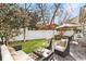 Well-manicured backyard with patio seating and a white fence, perfect for outdoor relaxation at 1827 Rockridge Pl, Atlanta, GA 30324