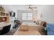 Bright bedroom featuring a TV, a window, a bed, a desk, and a mini refrigerator at 1827 Rockridge Pl, Atlanta, GA 30324