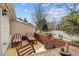 Wooden deck featuring lounge chairs, outdoor seating, and a view of the surrounding neighborhood and street at 1827 Rockridge Pl, Atlanta, GA 30324