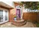 Welcoming front entrance with brick steps and a decorative door, complemented by lush greenery at 1827 Rockridge Pl, Atlanta, GA 30324