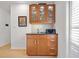 Kitchen butler's pantry with upper glass-door cabinets and lower cabinets for storage, countertop and tile backsplash at 1827 Rockridge Pl, Atlanta, GA 30324