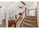 Inviting living room with hardwood floors, a fireplace, and staircase leading to the second floor at 1827 Rockridge Pl, Atlanta, GA 30324