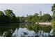 Scenic view of community pond and park with city skyline and walking distance to shopping and restaurants at 1827 Rockridge Pl, Atlanta, GA 30324