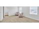 Bedroom features neutral carpeting, bright walls, and two upholstered accent chairs at 1586 Sungrown Way, Mcdonough, GA 30253