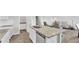 Open-concept kitchen with modern appliances, a large island, and a seamless transition into the living area at 1586 Sungrown Way, Mcdonough, GA 30253