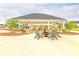 Community pavilion offering shaded seating around a central fire pit, ideal for outdoor gatherings and relaxation at 1586 Sungrown Way, Mcdonough, GA 30253