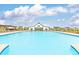 Large community pool provides a refreshing recreational space with poolside amenities and picturesque surroundings at 1586 Sungrown Way, Mcdonough, GA 30253