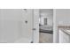 Modern walk-in shower with white subway tile and sleek fixtures, adjacent to the main bedroom at 1586 Sungrown Way, Mcdonough, GA 30253