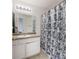 Standard bathroom with a shower/tub combo, vanity, and neutral countertops at 1450 Riverrock Trl, Riverdale, GA 30296