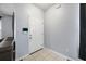 Home entryway featuring a white door, neutral paint, and tile flooring at 1450 Riverrock Trl, Riverdale, GA 30296