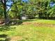 Lush backyard showcasing green grass and a storage shed, ideal for outdoor activities at 30 N Cleveland Church Rd, Mcdonough, GA 30253
