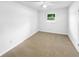 Bedroom with neutral carpet, a ceiling fan, a window to the outside, and white walls at 30 N Cleveland Church Rd, Mcdonough, GA 30253