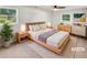 Cozy bedroom features two windows, neutral decor, and contemporary furniture at 30 N Cleveland Church Rd, Mcdonough, GA 30253